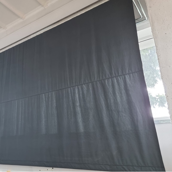 Roller shutter system for winding blackout curtains with electric drive